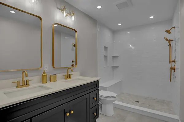 JB Plumbing HVAC bathroom remodel with walk-in shower and double vanity in Reading PA