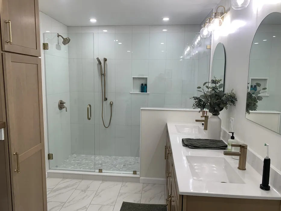 Walk-in shower conversion with glass shower door, completed by JB Plumbing HVAC in Reading PA