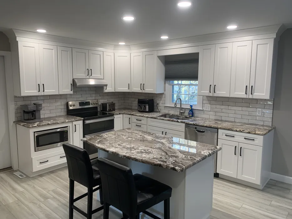 Kitchen remodel with marble countertops by JB Plumbing HVAC