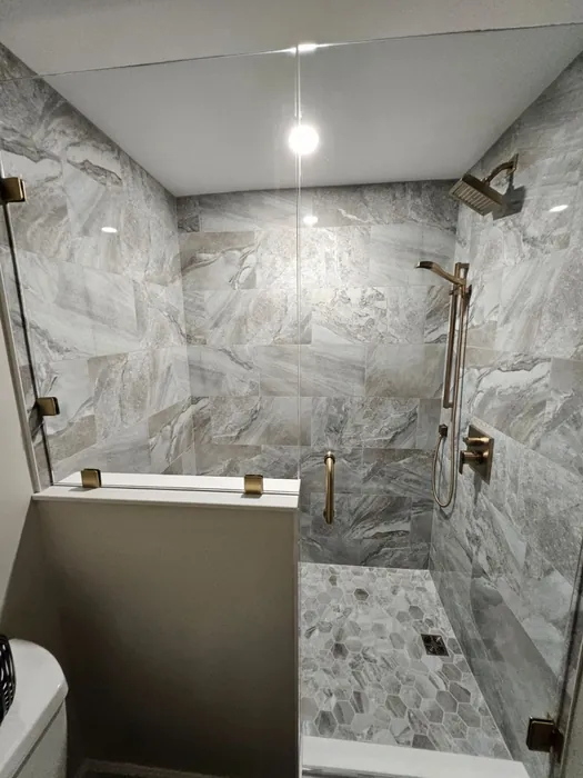 Marble shower bathroom remodel finished by JB Plumbing HVAC