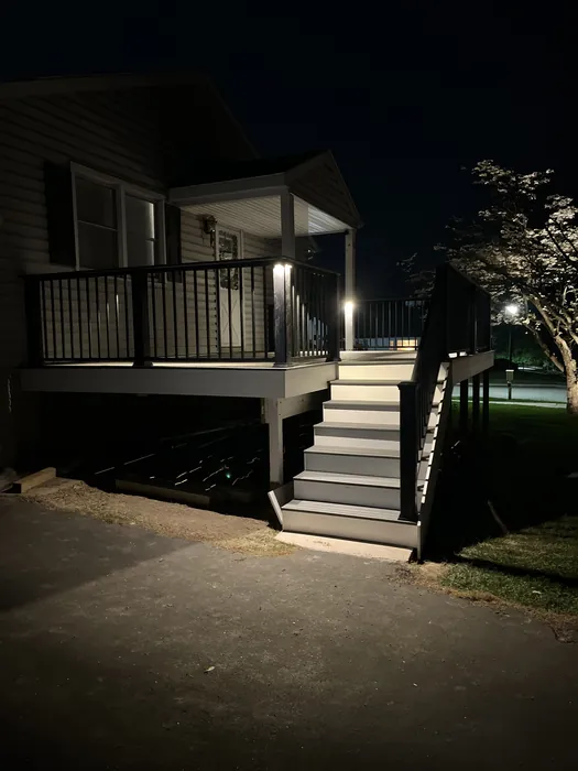 Outdoor patio stairs with nighttime lighting, completed by JB Plumbing HVAC